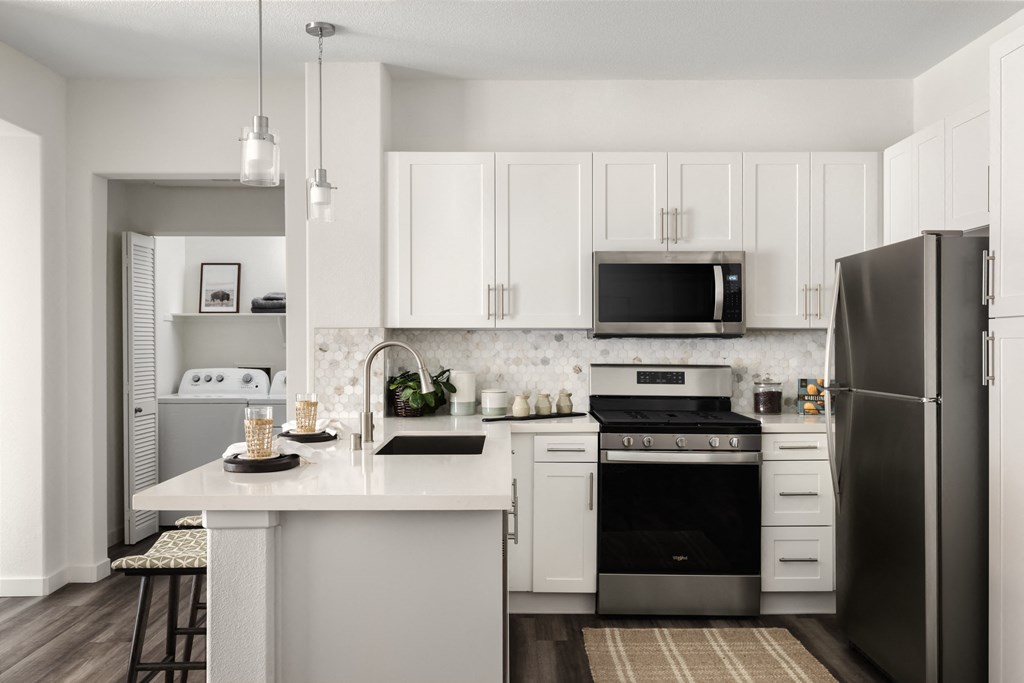 Update kitchens with stainless steel appliances at City Lights at Town Center Apartments in Aliso Viejo