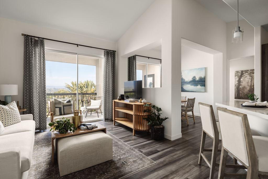 Newly renovated living and dining rooms at City Lights at Town Center Apartments in Aliso Viejo