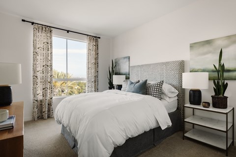 Bedrooms with views of the mountains or courtyards at City Lights at Town Center Apartments in Aliso Viejo