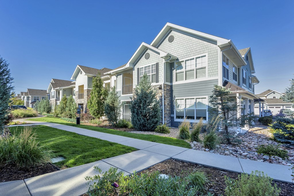Walking paths and pet waste stations at Lucent Blvd Apartments in Highlands Ranch