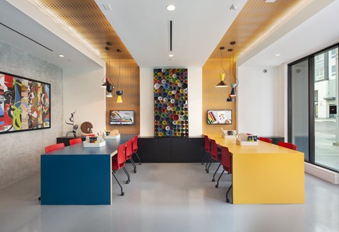 Co-work area with community seating at Symmetry apartments in Northridge.
