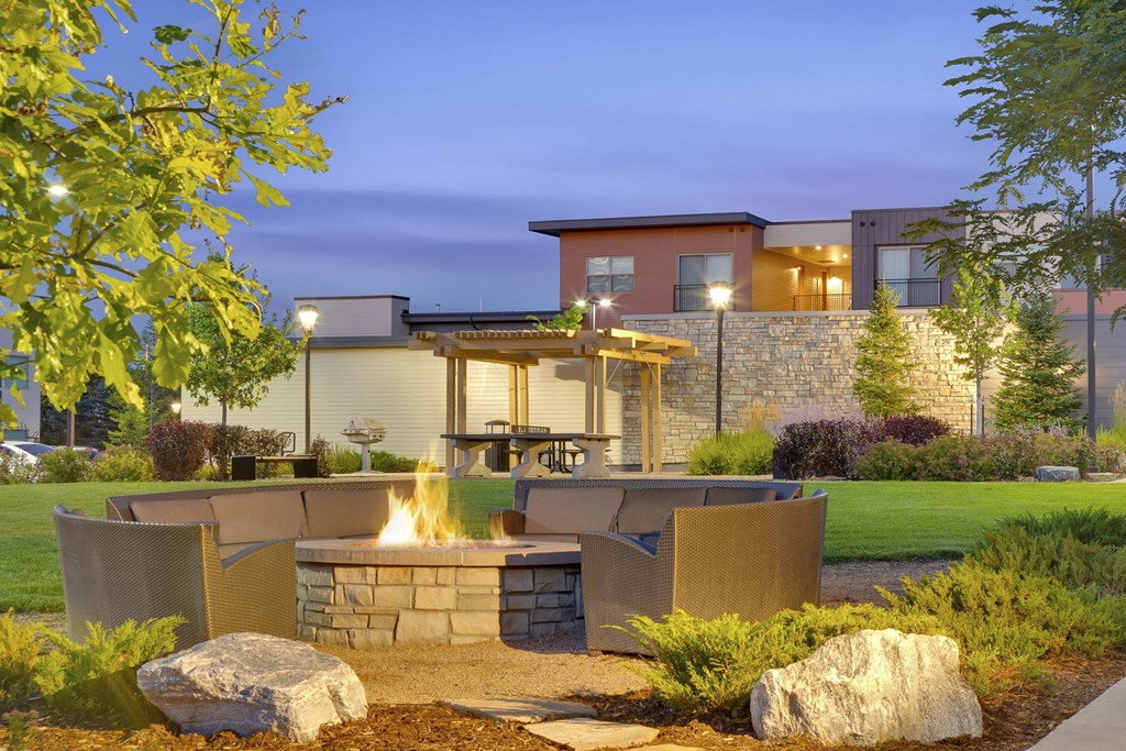 Fire pit with seating area at Vela Meridian Apartments in Parker