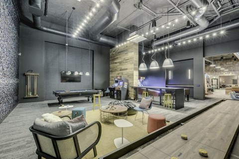 Billiards and shuffleboard in the resident lounge at Leeward Apartments in Seattle.