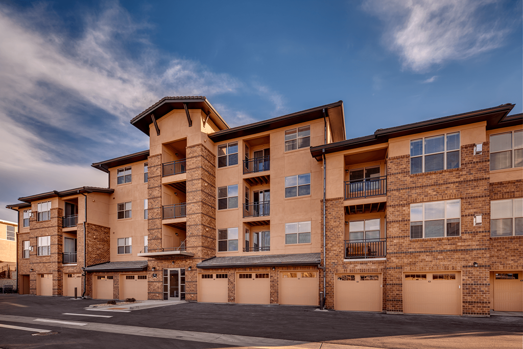 Exterior of the apartment complex featuring garages at Zenith Meridian apartments in Englewood.