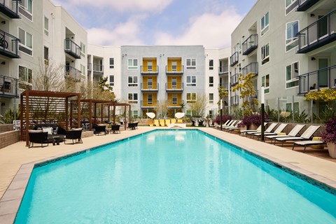Poolside cabanas at at Symmetry apartments in Northridge.