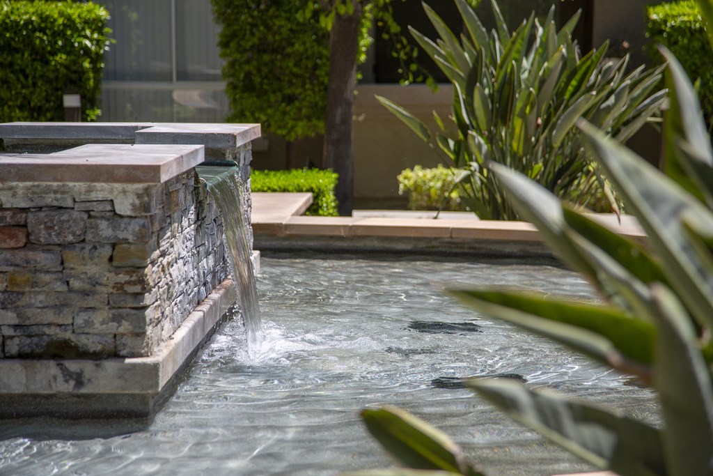 Flowing waterscapes and fountains at City Lights at Town Center Apartments in Aliso Viejo