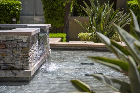 Flowing waterscapes and fountains at City Lights at Town Center Apartments in Aliso Viejo