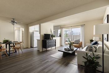 Wood-style flooring throughout living area in first floor homes