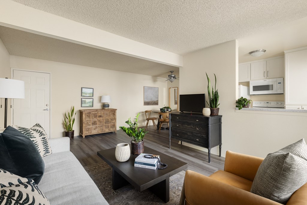 Living area with half-wall to the kitchen at Cerritos Apartments
