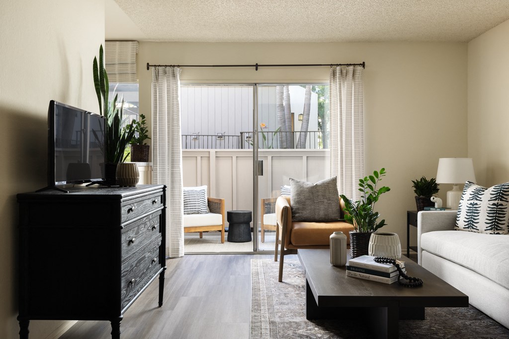 Living area that opens to patio space at Cerritos Apartments