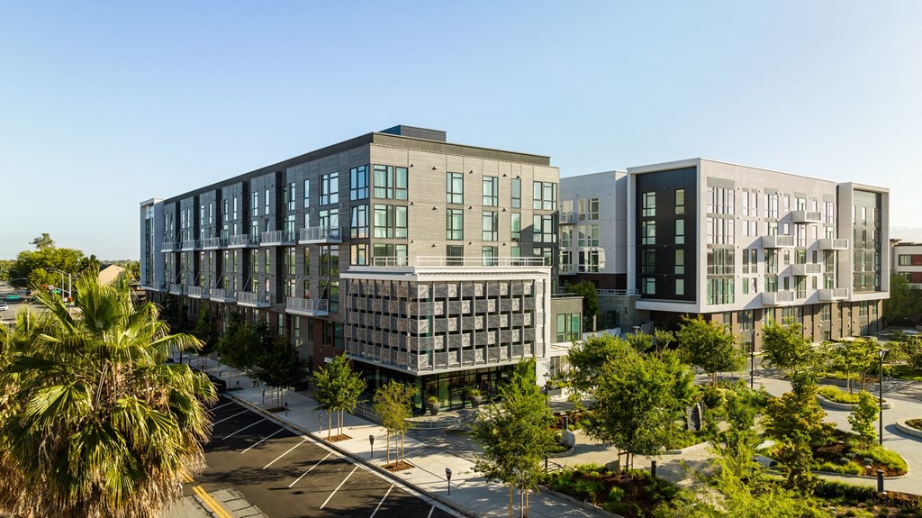 North building exterior with park at Sixth & Jackson apartments in San Jose.