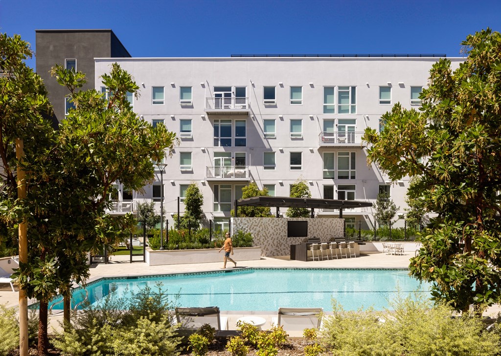 North building with a view of the pool at Sixth & Jackson apartments in San Jose.