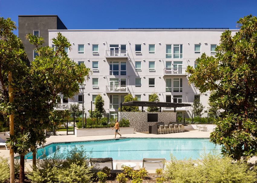 sixth & jackson apartments san jose north building pool with man walking