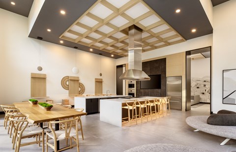 a large kitchen and dining area with a wooden table and chairs