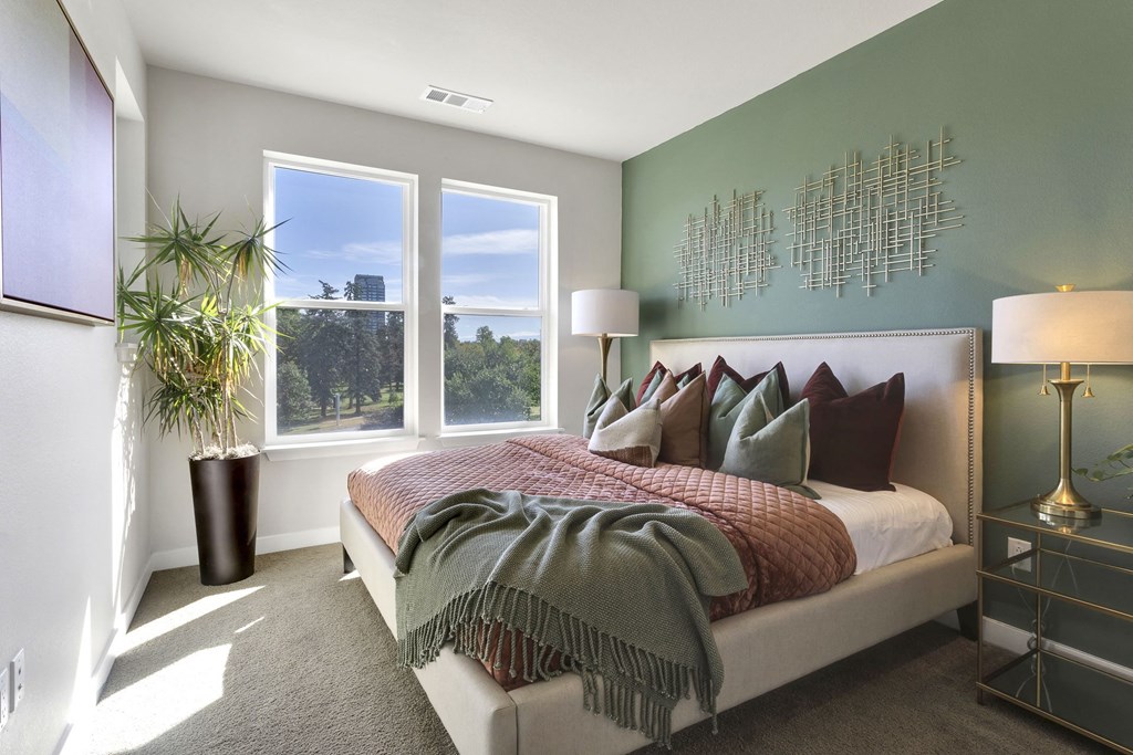 Bedroom with carpet and big picture windows at The York on City Park in Denver