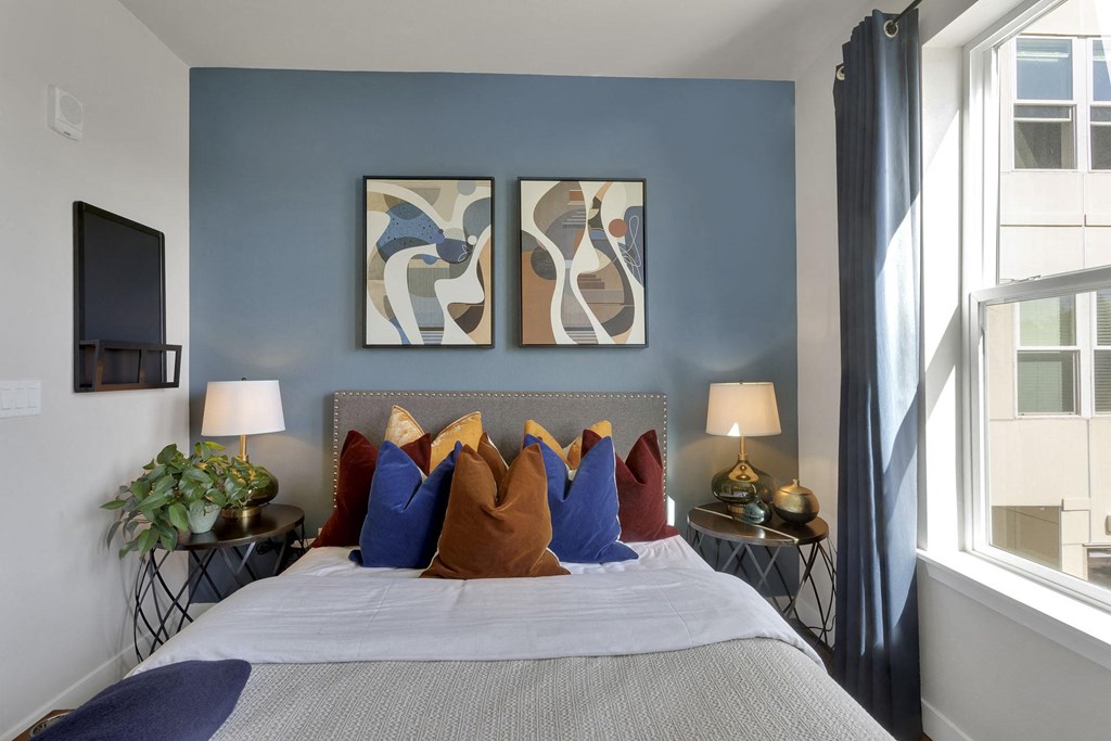 Closeup on bedroom area in studio at The York on City Park in Denver