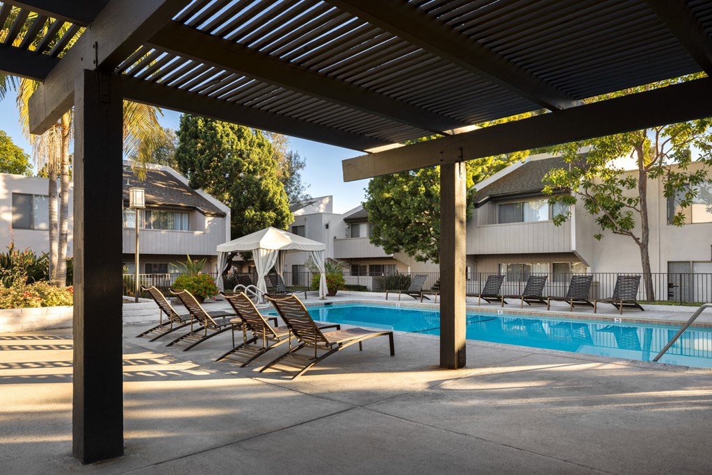Wooden pergola and seating at Cerritos Apartments