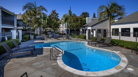 Poolside seating at Crystal Springs apartments in Fountain Valley.