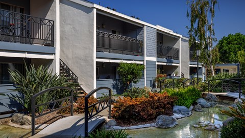 Outdoor shot of the apartment complex Crystal Springs apartments sign at Crystal Springs apartments in Fountain Valley.