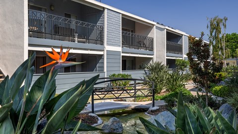 Outdoor walkways at Crystal Springs apartments in Fountain Valley.