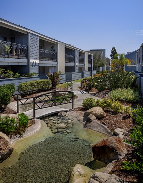 Outdoor pathways to walk at Crystal Springs apartments in Fountain Valley.