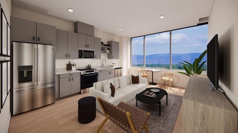 A model unit kitchen with a view from a large window at Lofts on Monaco in Denver.