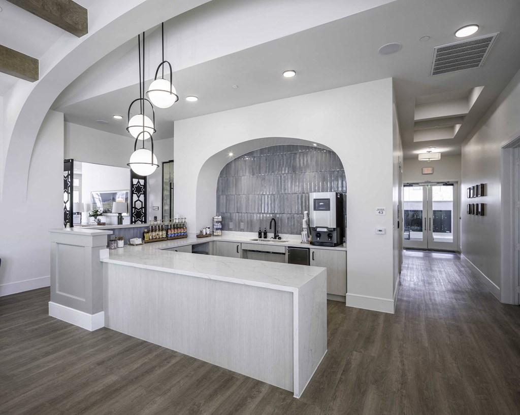 community kitchen with a large island and coffee bar