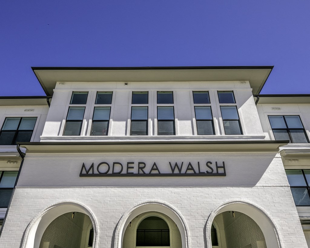 the facade of a building with a wall sign