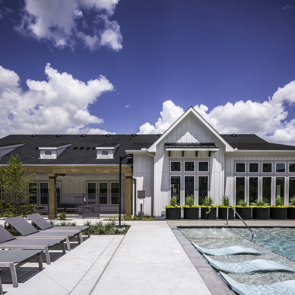 Resort style pool with lounge chairs
