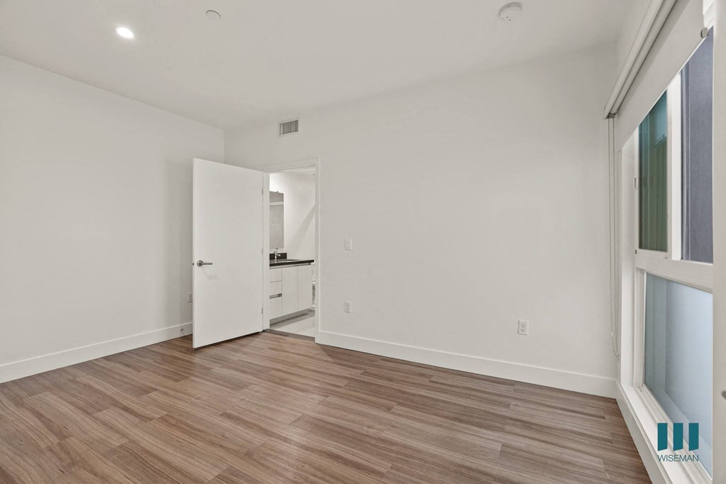 Bedroom with Large Windows,  Recessed Lighting, and Vinyl Flooring