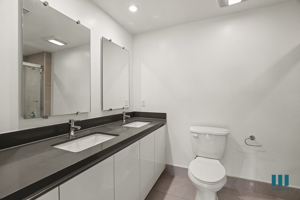 Bathroom with Double-Sink Vanity and Cabinet Storage