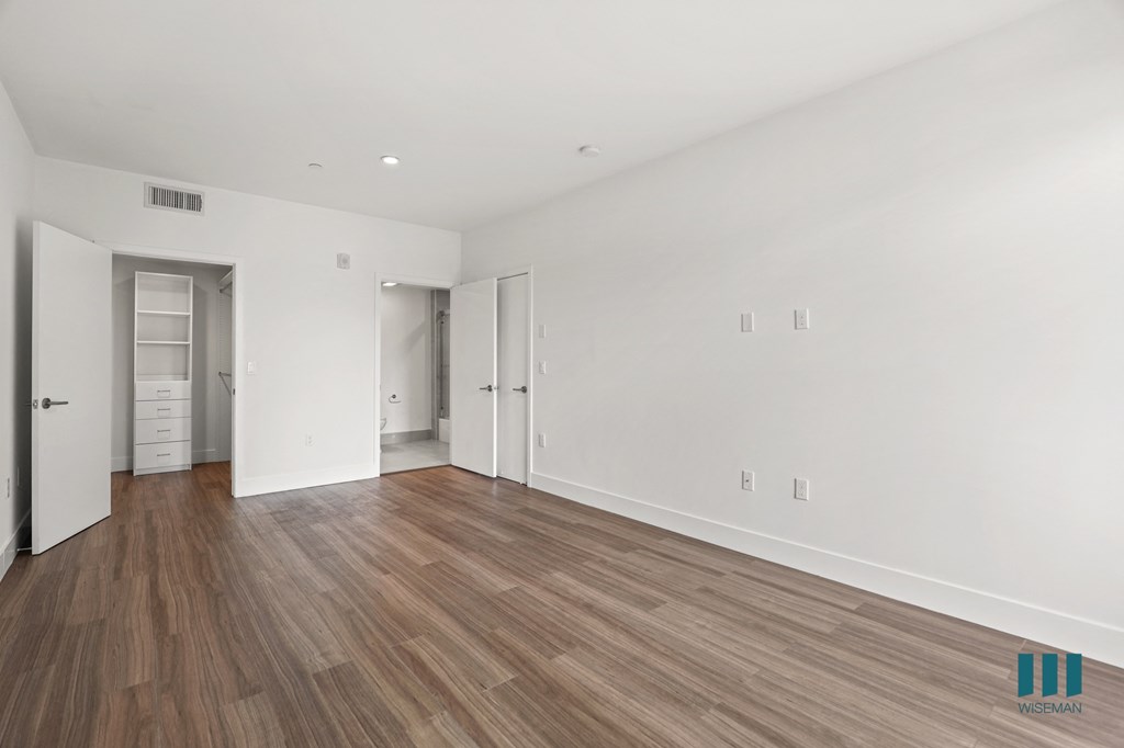 Bedroom with Walk-In Closet with Built-In Organizers