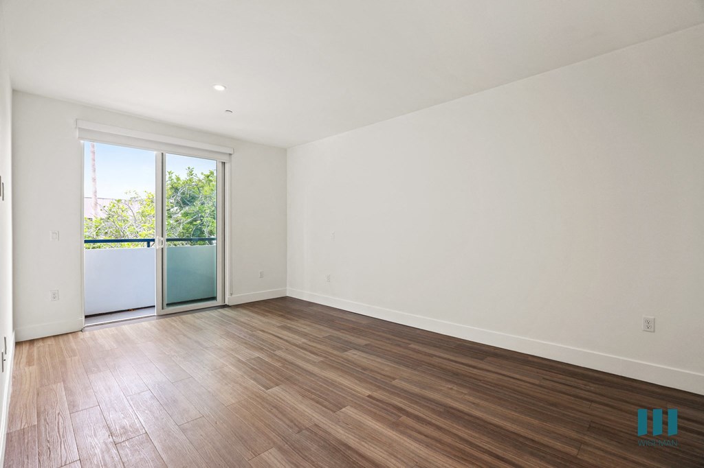 Living Room with Patio, Vinly Flooring, and Recessed Lighting