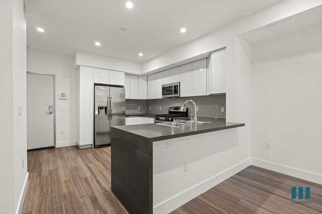 Open-Concept with Energy-Efficient Appliances and Countertop Bar