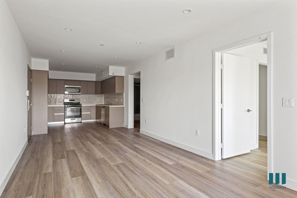 a renovated living room and kitchen in a new home