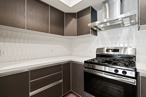 a kitchen with a stove and a microwave