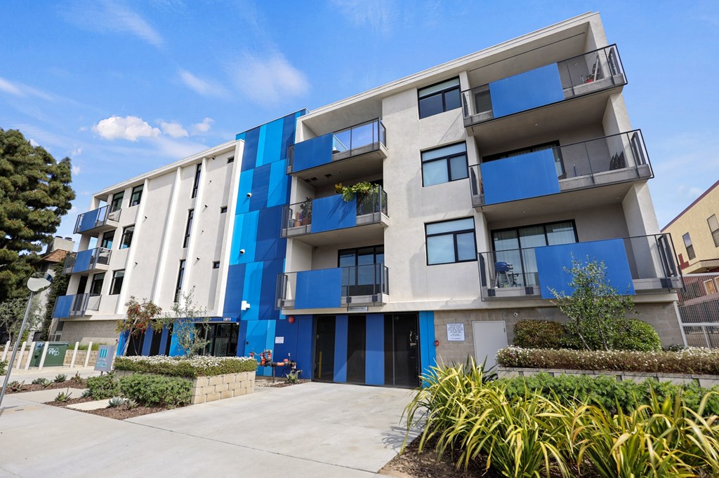 Sidewalk View of Palm Blue by Wiseman, an apartment community in Palms