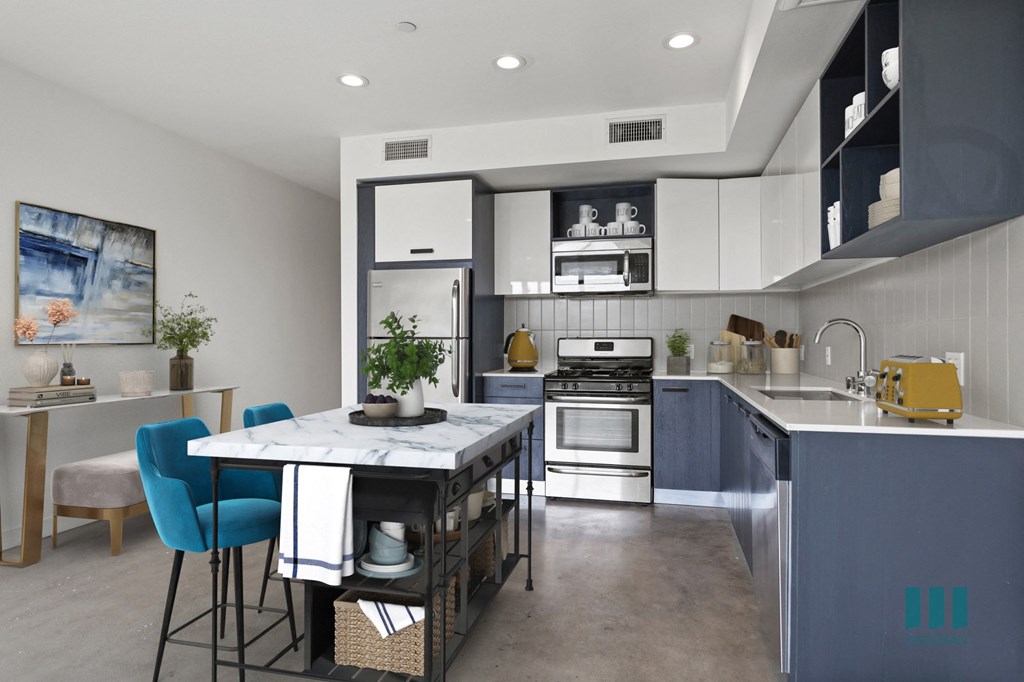 Open-Concept Kitchen and Dining Space with Concrete Flooring