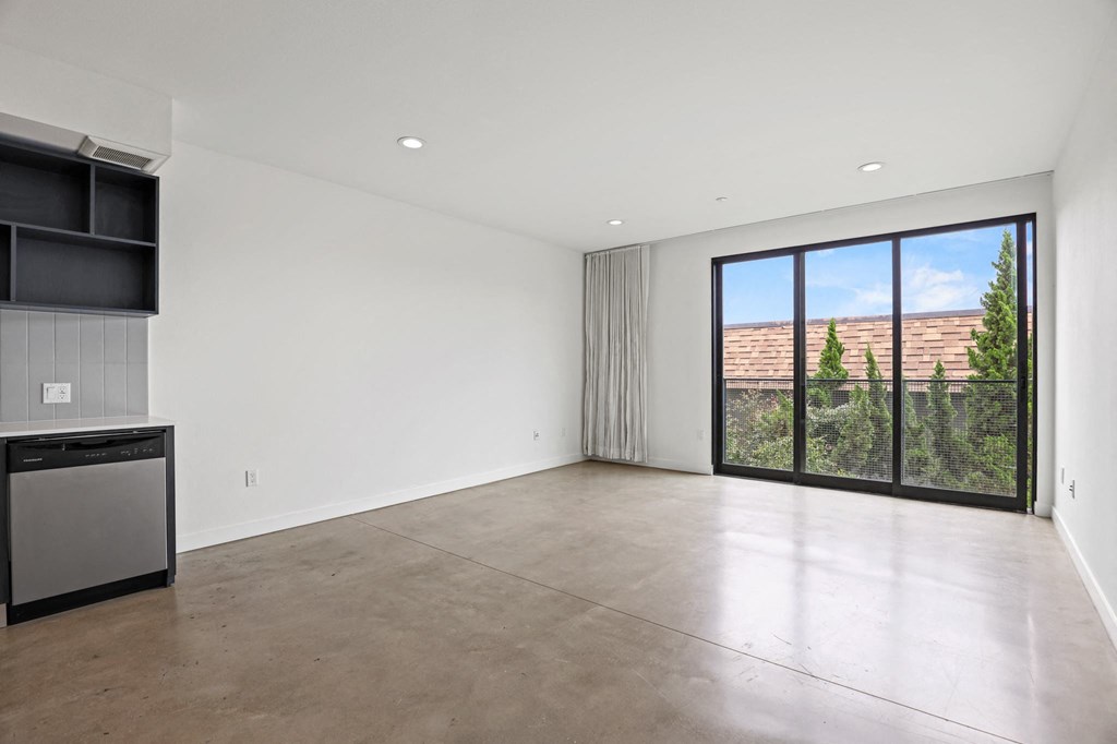 Dining and Living Room with Recessed Lighting and Concrete Flooring