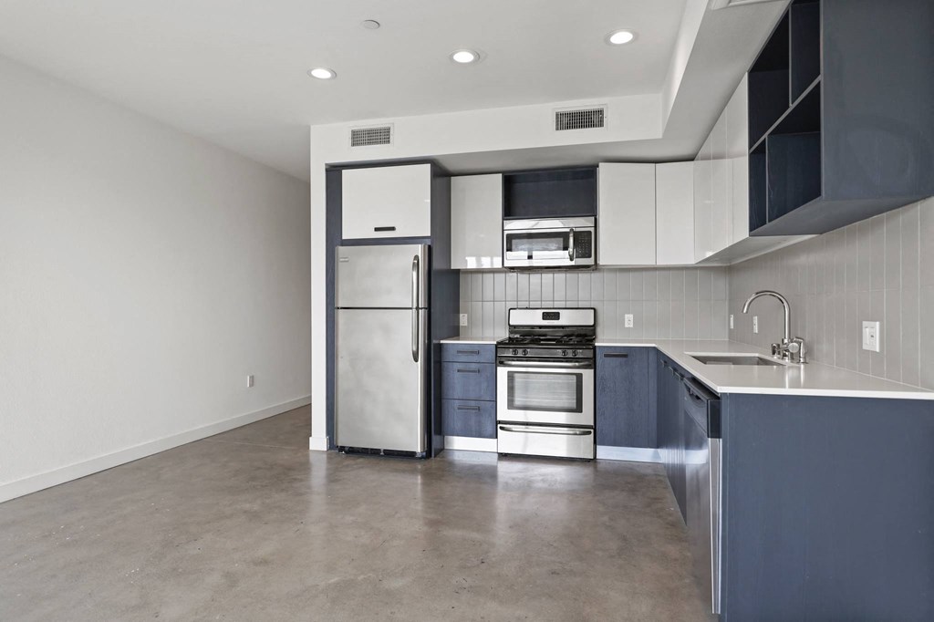 Modern Kitchen with Blue Cabinetry and Stainless-Steel Appliances