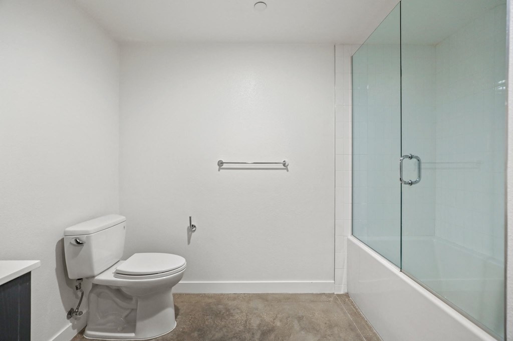 Large-Size Bathroom with a Shower Bath with Glass Door