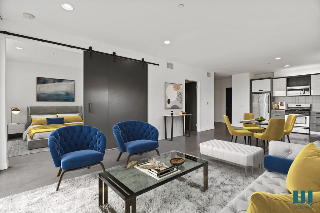 Open-Concept Kitchen, Dining, and Living Room Space with Enclosed Bedroom