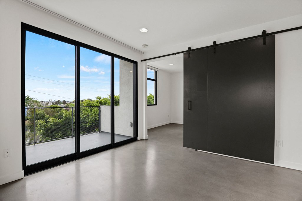 Living Room Space with patio and Bedroom with Sliding Door