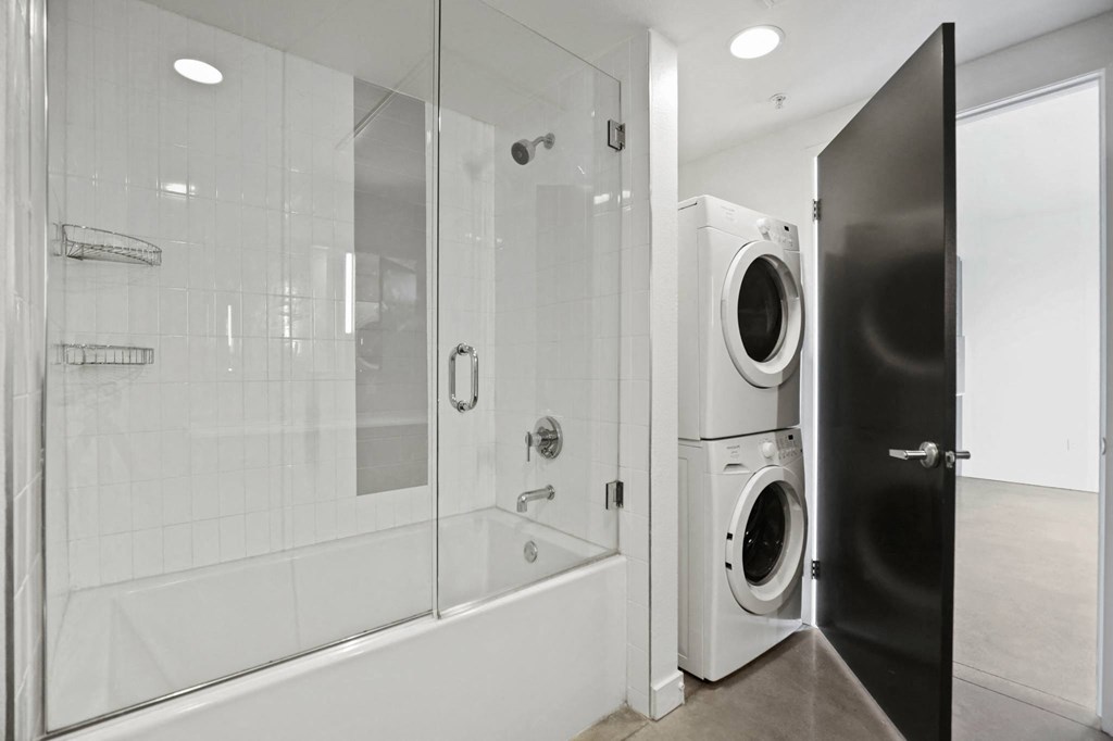 Bathroom with In-Suite Washer & Dryer and Full-Size Shower Bath