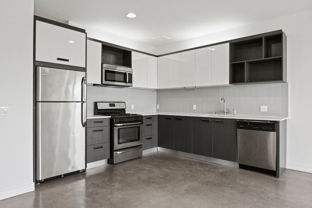 Kitchen with Stainless-Steel Refrigerator, Stove, Microwave Oven, and Dishwasher