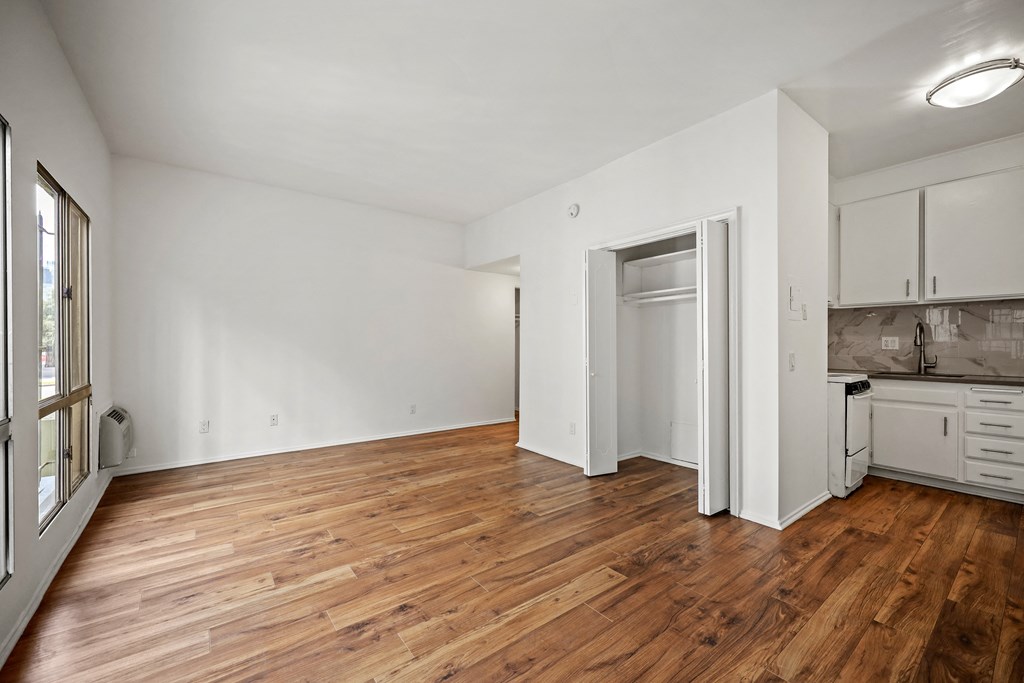 A room with wooden floors and white walls.