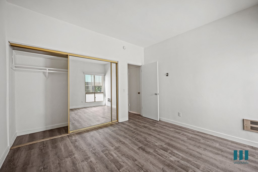 A room with a sliding door and a window.