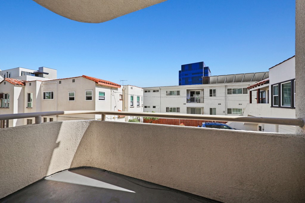 the view from the balcony of the apartment building of the city