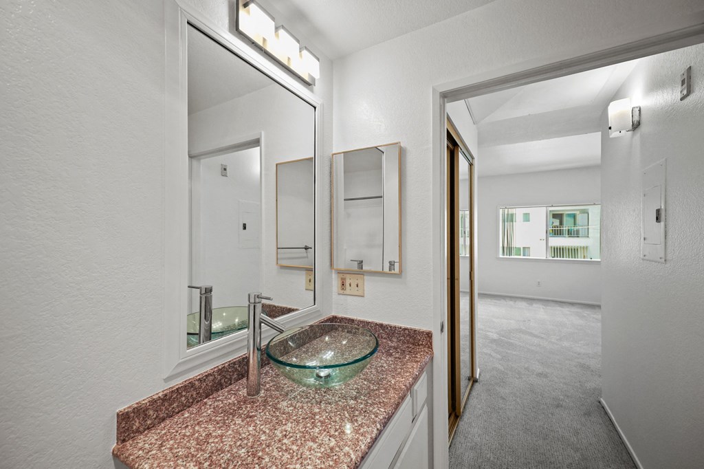 a bathroom with a sink and a mirror