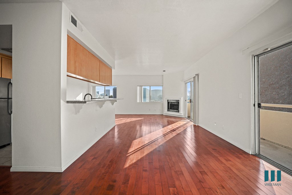 A room with wooden floors and white walls.
